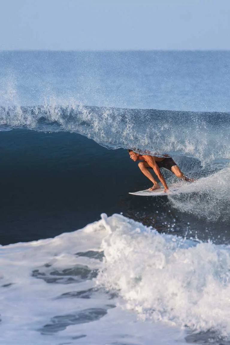 Surfer riding a wave in Santa Teresa