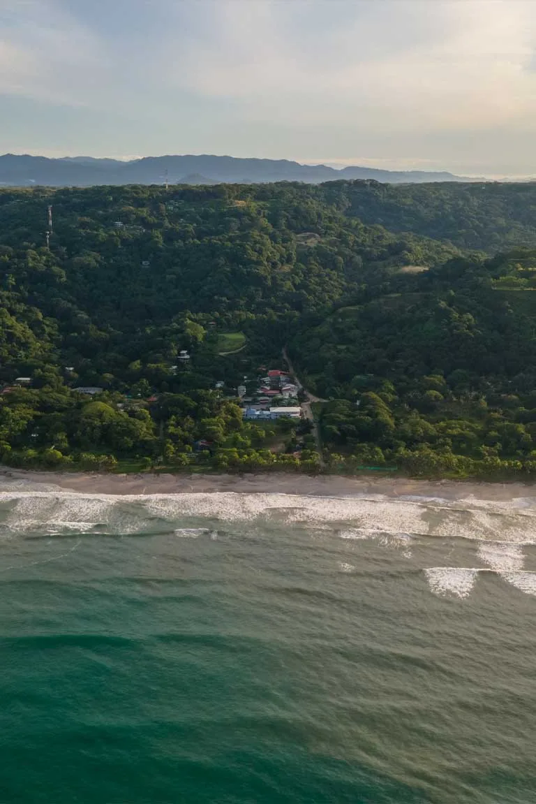 Santa Teresa beach and forested hills