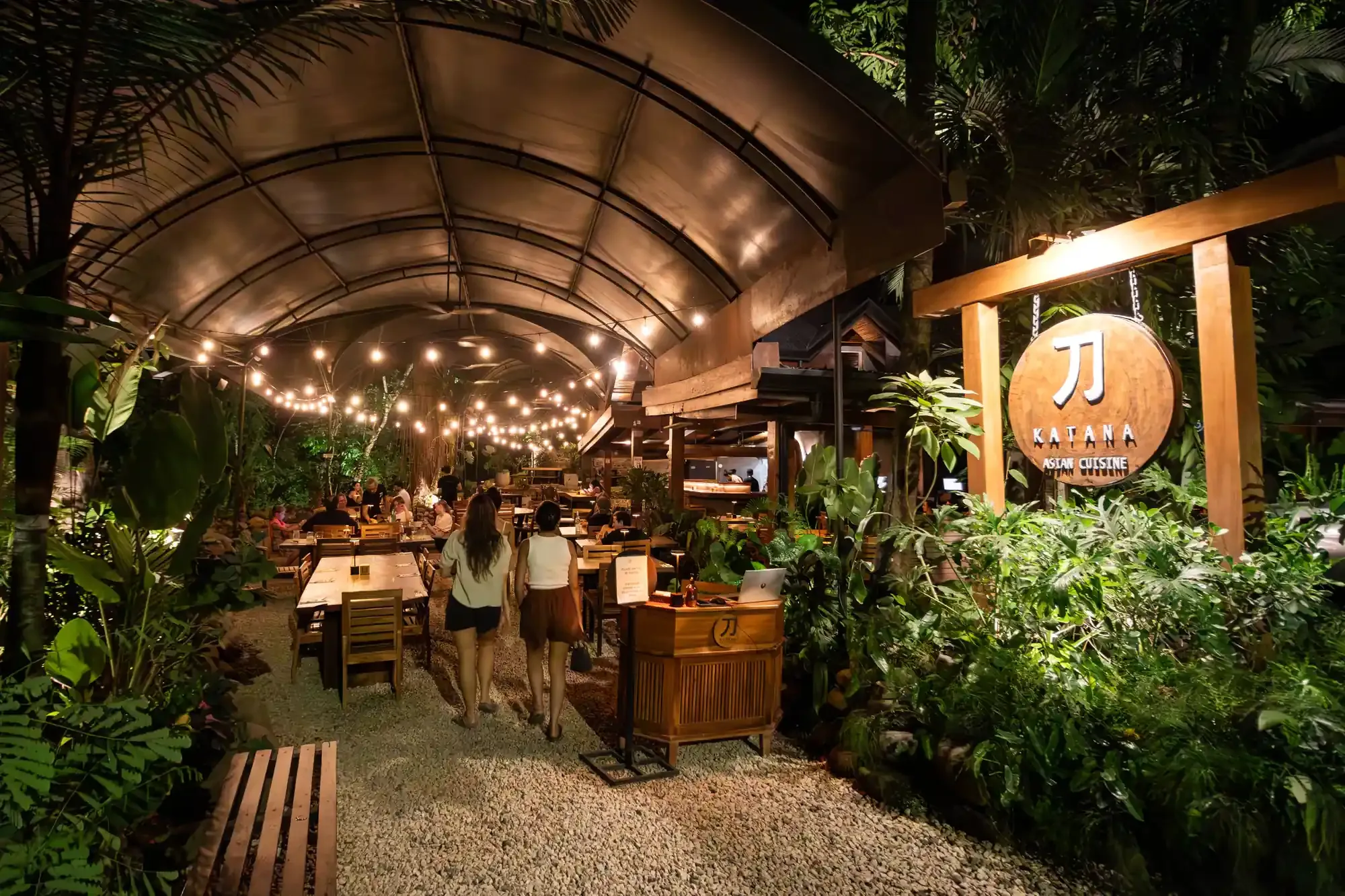 Open-air restaurant with string lights