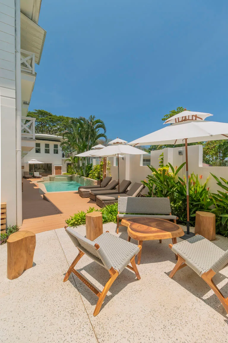 Pool deck with sun loungers and umbrellas