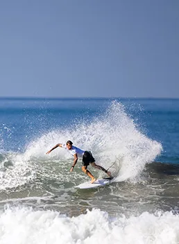 Surfer riding a wave in Santa Teresa