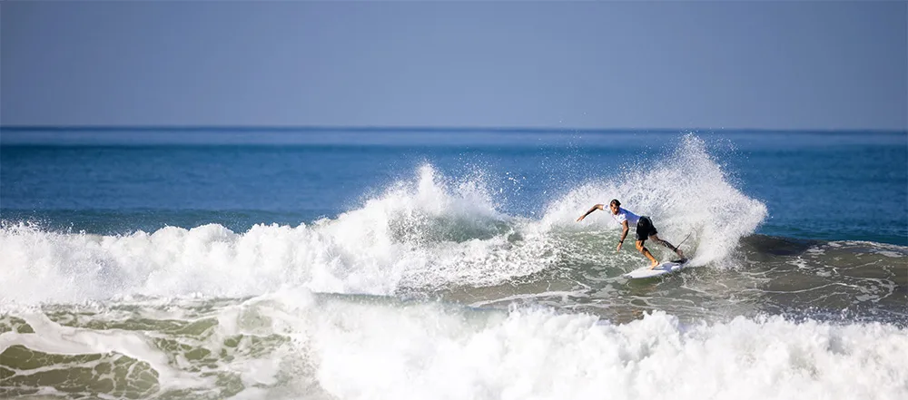Surfer riding a wave in Santa Teresa
