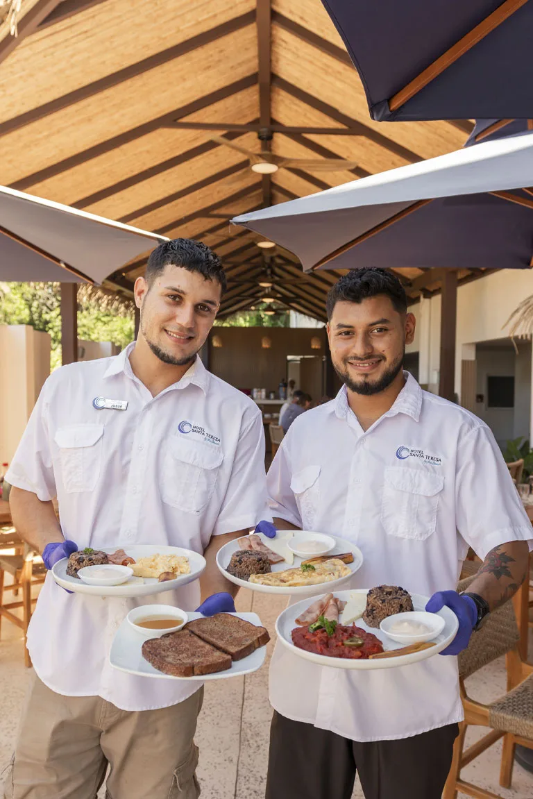 Hotel staff serving Costa Rican breakfast